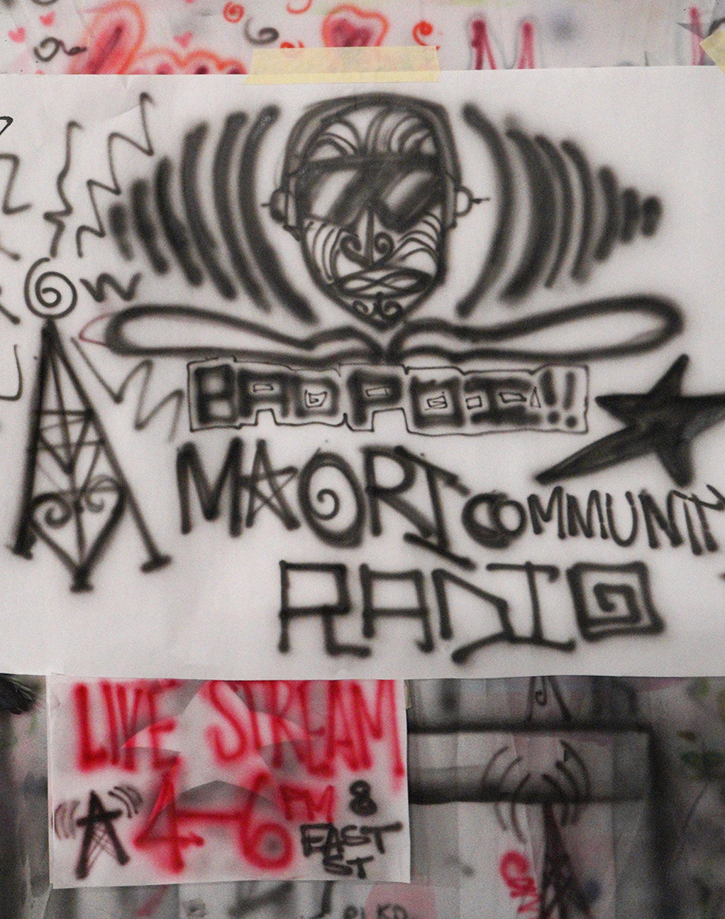 An airbrush painted poster illustrating Badpoi Māori community radio.